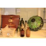 Stripped pine cupboard, Chemist's bottles, Tiffany light shade, stone bottle,
