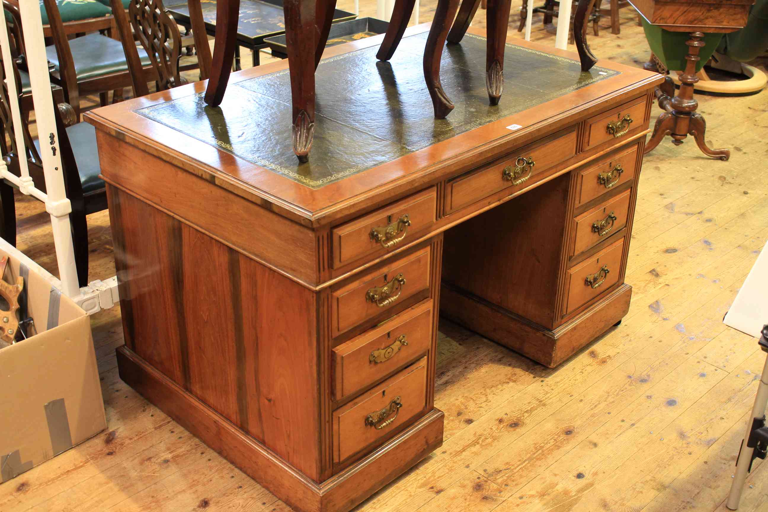 Late Victorian walnut nine drawer pedestal desk