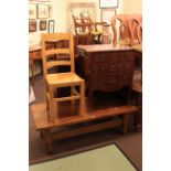 Rectangular oak coffee table, three drawer mahogany chest,
