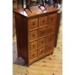 Oriental redwood chest of twelve drawers