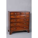 AN EARLY 19TH CENTURY MAHOGANY FLAT FRONTED CHEST OF DRAWERS,