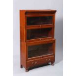 AN EARLY 20TH CENTURY MAHOGANY STACKING BOOKCASE,