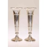 A PAIR OF GEORGE V SILVER VASES, Robert Pringle, London 1927, of trumpet form, weighted.