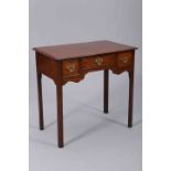 A MAHOGANY LOWBOY, GEORGE III AND LATER, the moulded rectangular top above three frieze drawers,