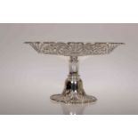 A VICTORIAN SILVER CAKESTAND, Sibray, Hall & Co, London 1899, the fretwork border with moulded edge,