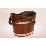 A COPPER BOUND WOODEN BUCKET, with leather and rope handle, removable tin liner.