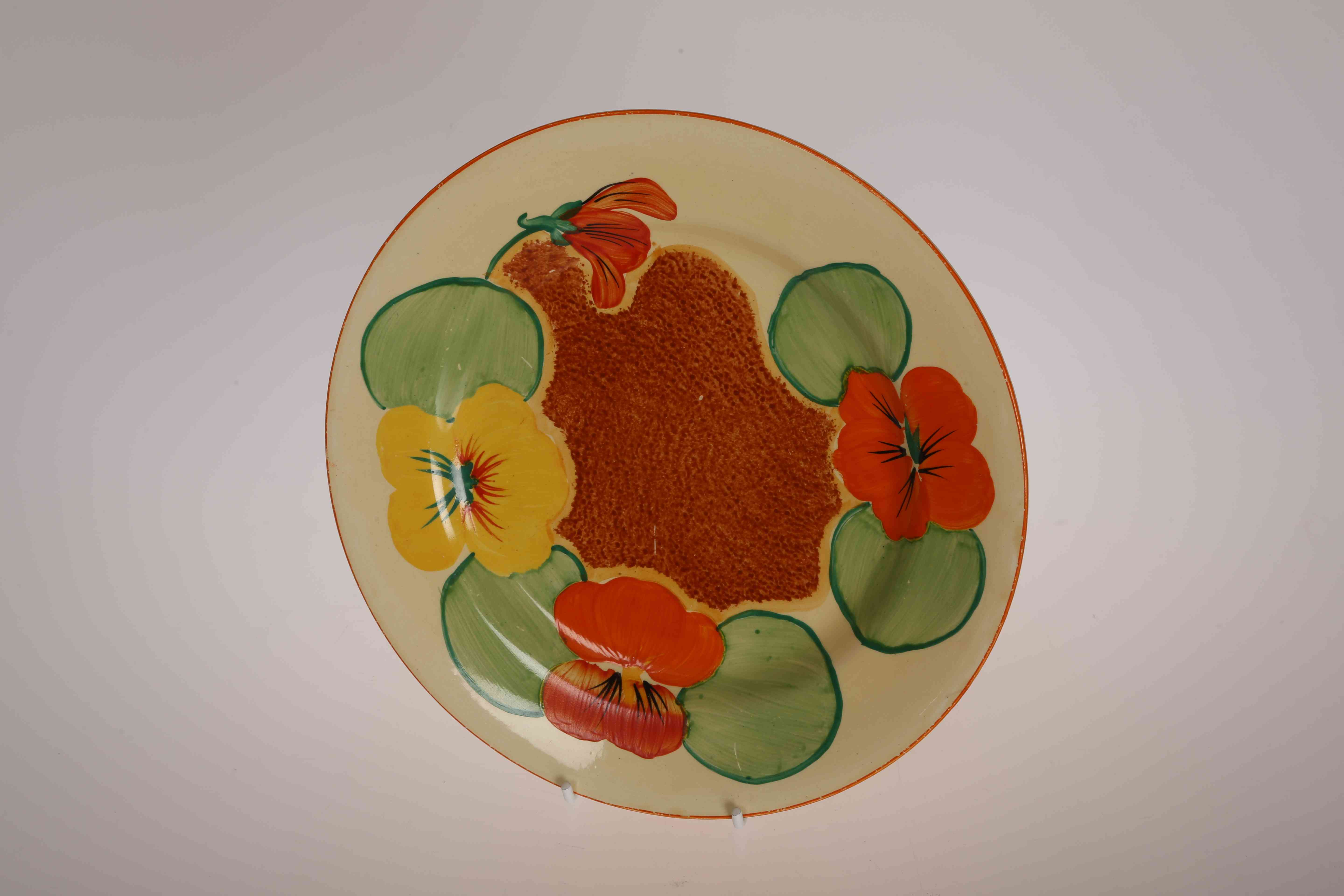 A CLARICE CLIFF "NASTURTIUM" PLATE, printed factory marks to base and incised no. 32.