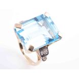 A BLUE TOPAZ AND DIAMOND RING,