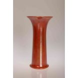 A RUSKIN POTTERY TRUMPET VASE, with orange lustre glaze, stamped Ruskin, England, 1925 to base.