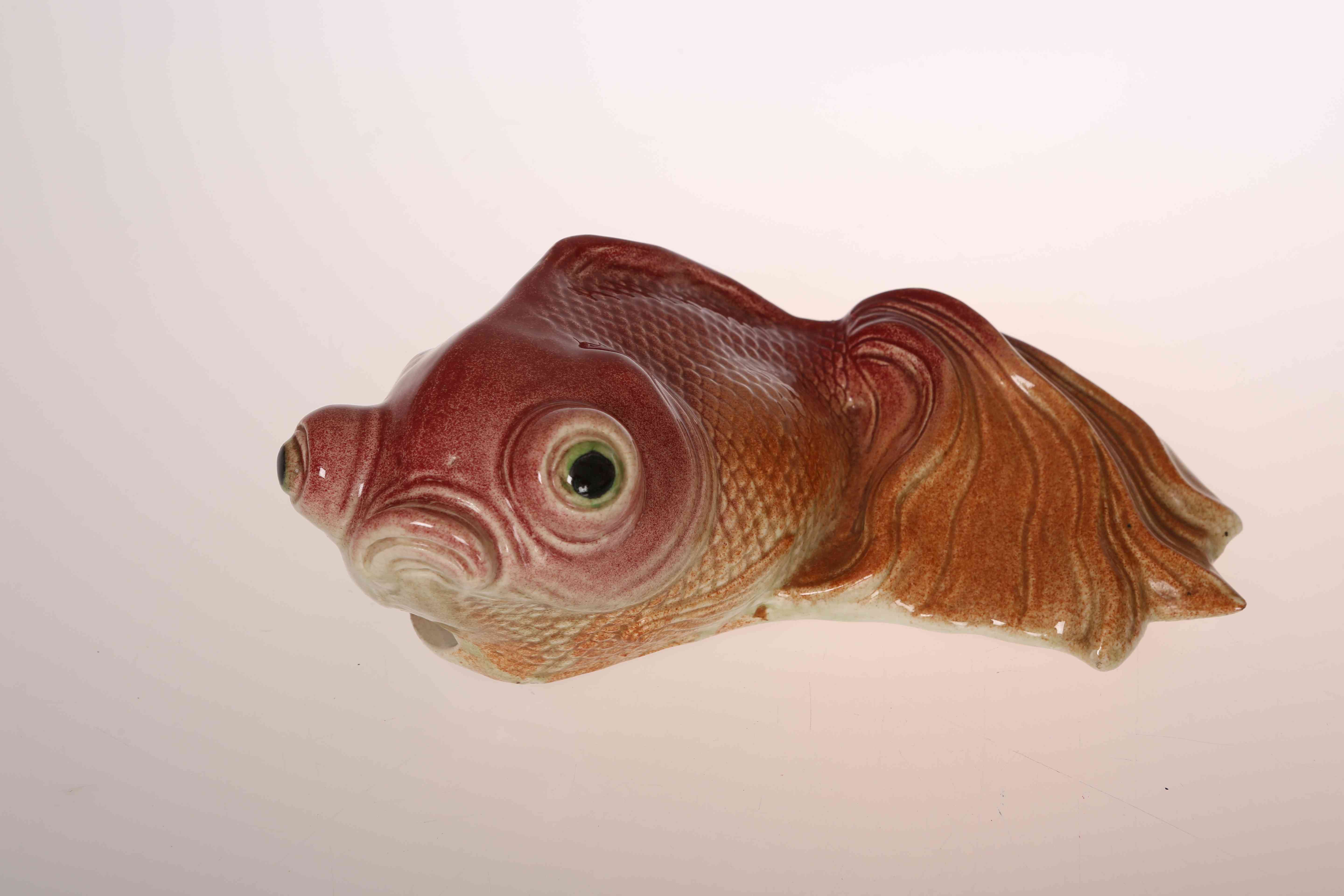 AN UNUSUAL JAPANESE POTTERY WALL POCKET MODELLED AS A FISH, with impressed and painted characters.