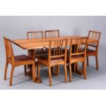 ALAN GRAINGER, AN ACORN INDUSTRIES OAK DINING SUITE,