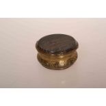 A 19TH CENTURY JASPER AND GILT METAL SNUFF BOX, circular with hinged cover. Diameter 5.