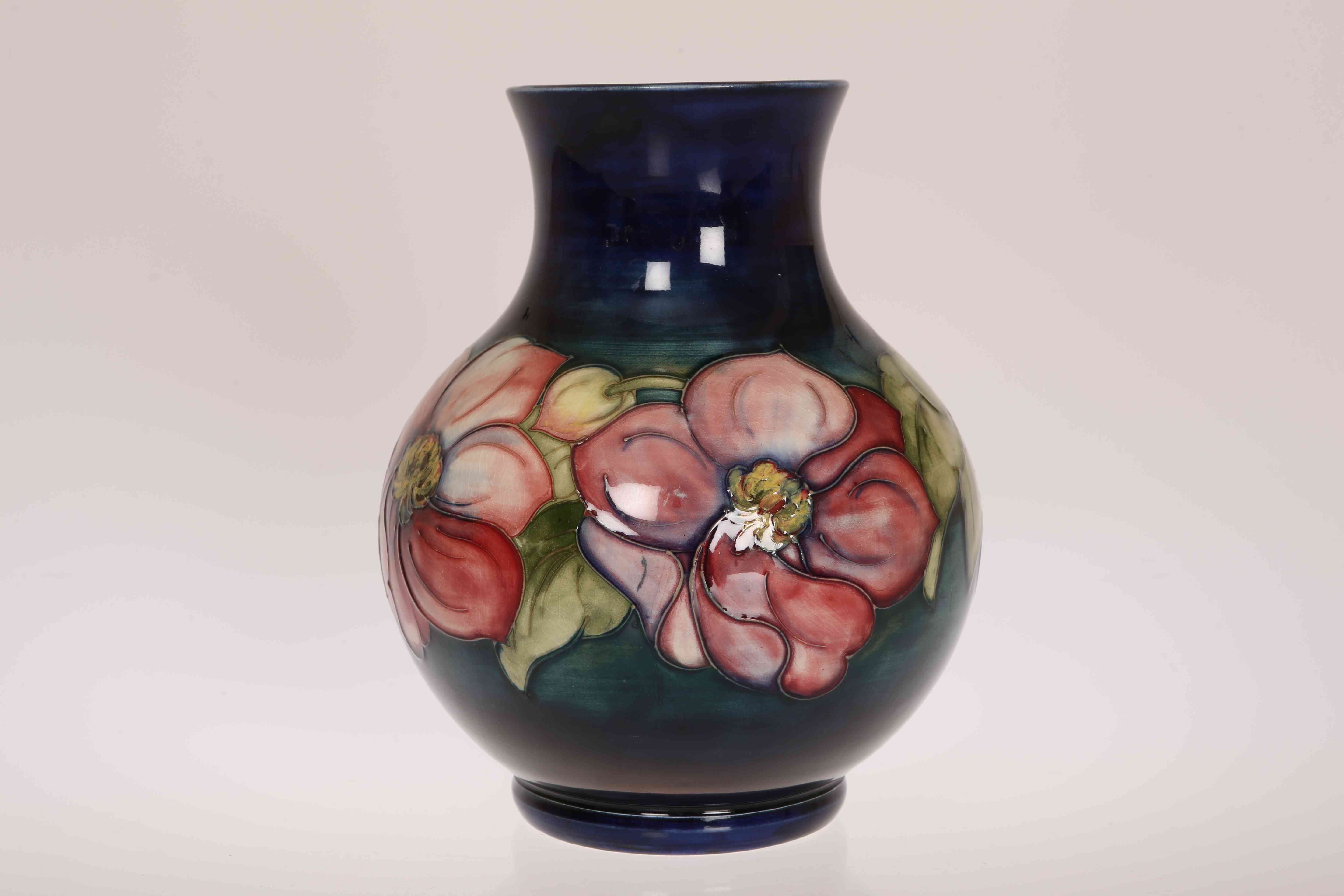 A LARGE MOORCROFT POTTERY ANEMONE VASE, of bulbous form, signed in blue on base.