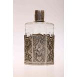 AN ORIENTAL WHITE METAL MOUNTED FLASK WITH SCREW TOP LID, with removable cup,