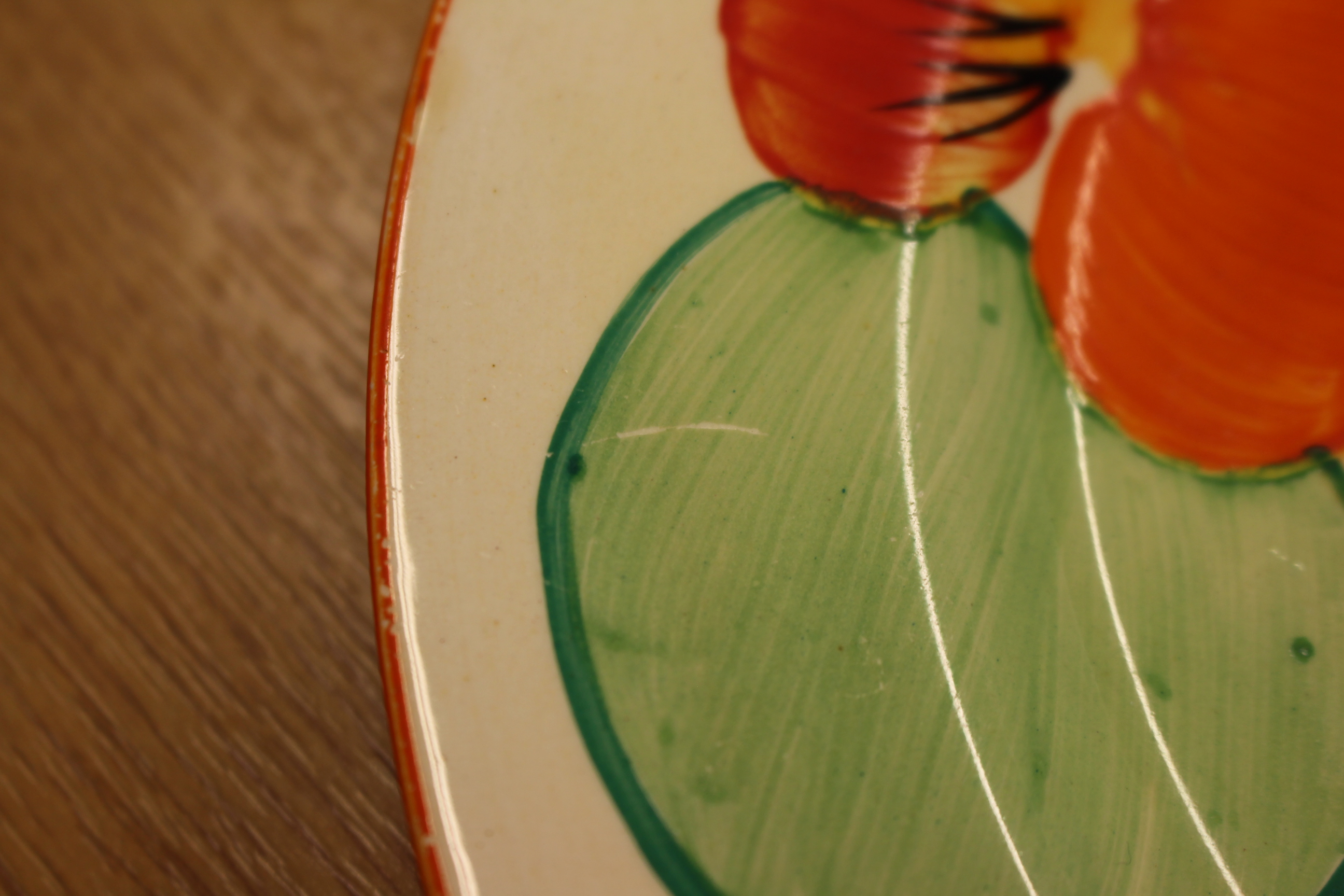 A CLARICE CLIFF "NASTURTIUM" PLATE, printed factory marks to base and incised no. 32. - Image 3 of 4