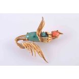 A CORAL, TURQUOISE AND GOLD BROOCH, modelled as a bird in flight,