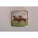 A STERLING SILVER AND ENAMEL CIGARETTE CASE, decorated with a horse racing scene.