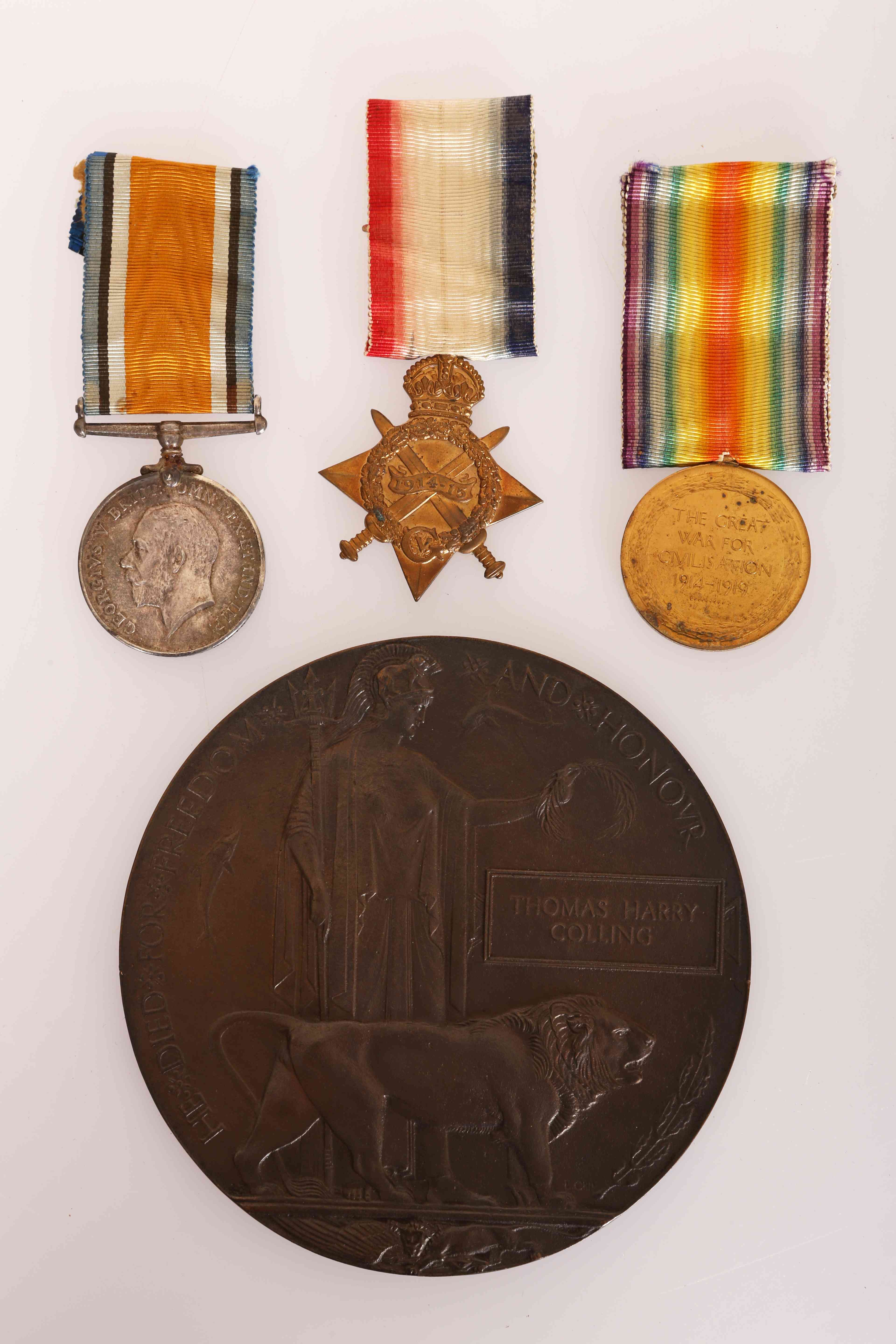 MEDALS: A WWI CASUALTY TRIO OF MEDALS AND DEATH PLAQUE, Pte. T.H.