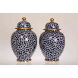 A PAIR OF LATE 19TH CENTURY STAFFORDSHIRE BLUE AND WHITE VASES AND COVERS,