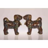 A PAIR OF CHINESE CLOISONNE ENAMEL CENSERS IN THE FORM OF DOGS,