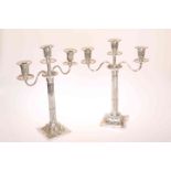 A NEAR PAIR OF VICTORIAN SILVER CANDELABRA, John Aldwinckle & Thomas Slater, London 1886 and 1888,