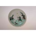 A CHINESE FAMILLE VERTE SAUCER DISH, decorated with an archer in a landscape,