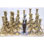 Nine pairs of 19th Century and later candlesticks (eight pairs brass)