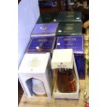 Six boxed Bell's whisky decanters