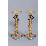 A PAIR OF GILDED AND PARTIALLY PAINTED BLACKAMOOR STANDS, of tripod form,