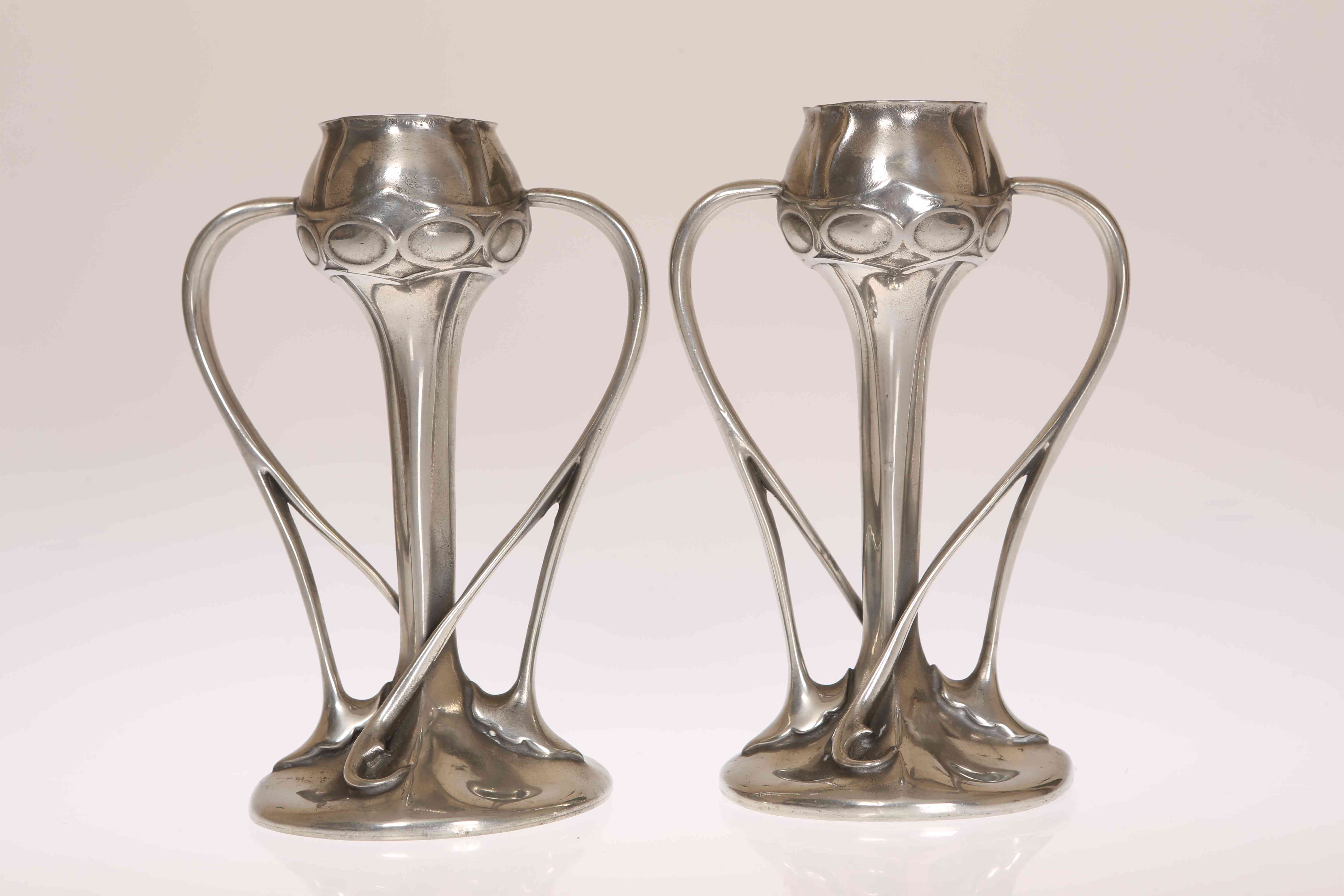 A PAIR OF LIBERTY & CO TUDRIC PEWTER TULIP VASES, DESIGNED BY ARCHIBALD KNOX,