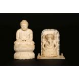 TWO INDIAN 19TH CENTURY IVORIES, the first carved as a buddha, the second as Ganesha.