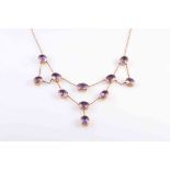 AN AMETHYST NECKLACE, CIRCA 1870, the eleven oval mixed cut slightly graduating amethysts,