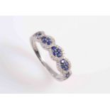 A SAPPHIRE AND DIAMOND RING,