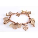 A GOLD CHARM BRACELET,