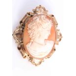 A VICTORIAN CAMEO BROOCH, the oval shell cameo carved to depict a woman's profile,