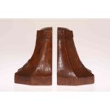 A PAIR OF YORKSHIRE OAK CRESTED BOOKENDS, each with castellated top and carved with a rose crest,