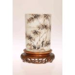 A CHINESE PORCELAIN BRUSH POT, of bamboo moulded cylindrical form, sepia painted with bamboo,