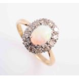 A VICTORIAN OPAL AND DIAMOND RING, CIRCA 1880, the oval cabochon cut opal six claw set,