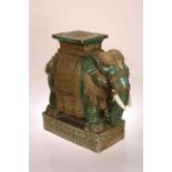 A CHINESE POTTERY GARDEN SEAT IN THE FORM OF A CAPARISONED ELEPHANT, probably 19th Century,