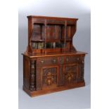 A CARVED OAK AND INLAID SIDEBOARD,