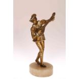 AN ART DECO COLD PAINTED METAL FIGURE OF A MINSTREL, raised on an alabaster oval base.