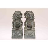 A PAIR OF CHINESE SOAPSTONE CARVINGS OF FU DOGS, possibly 19th Century.