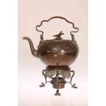 AN 18TH CENTURY COPPER SPIRIT KETTLE, BURNER AND STAND, chased and embossed with squirrels,