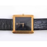 A RAYMOND WEIL GOLD PLATED QUARTZ WRISTWATCH, the rectangular case with two-tone black dial,