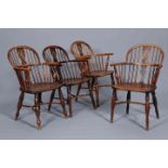 A HARLEQUIN SET OF FOUR EARLY 19TH CENTURY YEW WOOD WINDSOR CHAIRS,