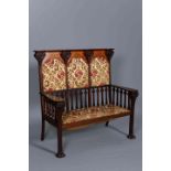 A FINE ART NOUVEAU MAHOGANY, SATINWOOD AND INLAID SETTLE,