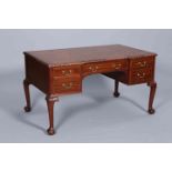 A CHIPPENDALE STYLE MAHOGANY AND LEATHER INSET WRITING DESK,