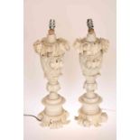 A PAIR OF CARVED ALABASTER TABLE LAMPS, each carved with leaves and flowerheads in high relief,