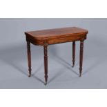 A REGENCY BRASS INLAID MAHOGANY FOLDOVER CARD TABLE, the crossbanded,