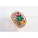 A DIAMOND, EMERALD, TOPAZ AND RUBY RING,